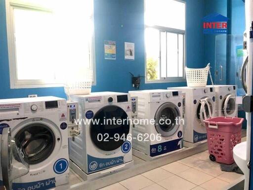 Bright laundry room with multiple washing machines