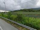 Countryside road with fields and hills