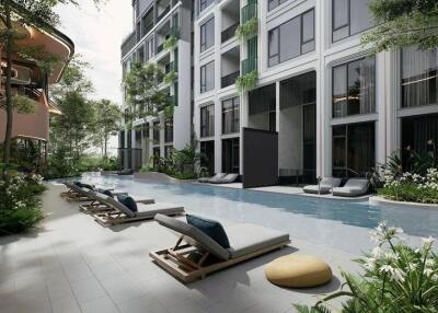 Modern outdoor pool area with lounge chairs in a residential complex