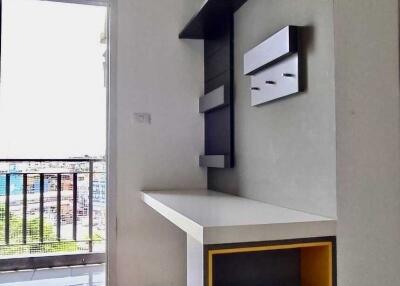 Minimalistic living room with balcony access and modern shelving