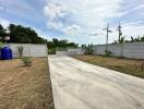 Spacious outdoor area with paved driveway