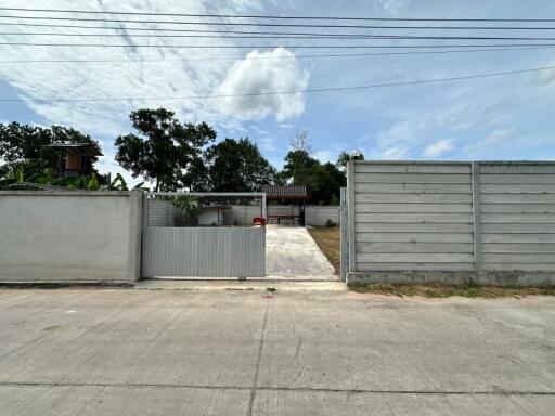 Gated entrance and driveway to property