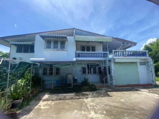 Two-story residential building with outdoor area