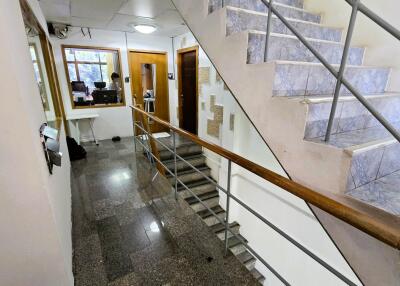 Interior view of a building corridor with stairs