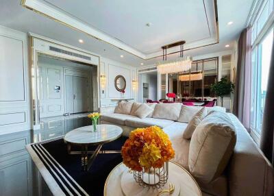 Elegant living room with luxurious decor and a large beige sectional sofa