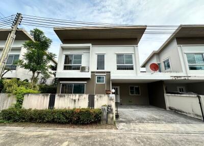 Exterior view of a modern two-story house with a driveway