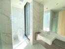 Modern bathroom with large window, marble walls, and freestanding sink