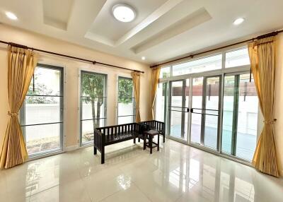 Bright living room with large windows and seating bench