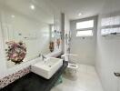 Clean and modern bathroom with large mirror and stylish decor