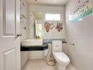 Clean and well-lit bathroom with decorative wall tiles