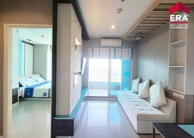 Modern living room with adjacent bedroom and balcony