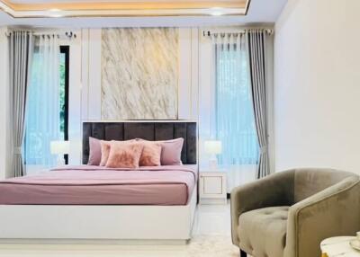Spacious bedroom with pink bedding