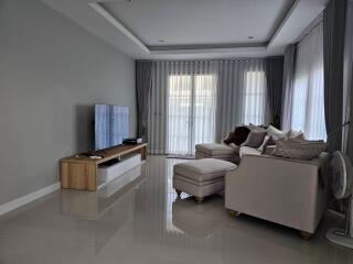 Modern living room with sectional sofa and large TV