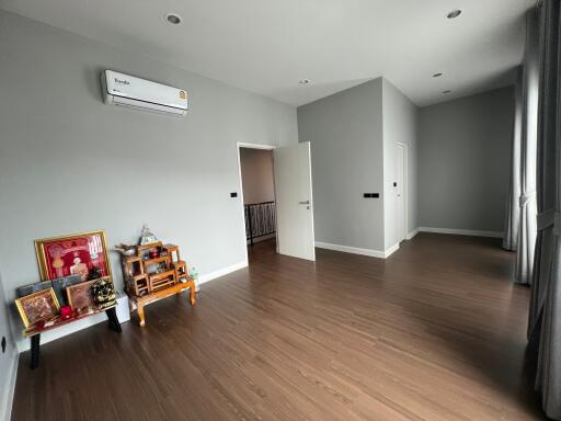 Spacious living room with wooden flooring