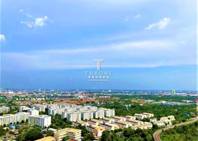 Aerial view of a cityscape with buildings and greenery