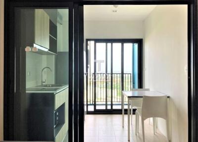 Modern kitchen and dining area with sliding glass doors and balcony view