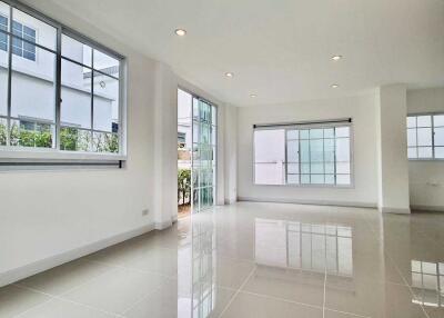 Spacious living room with large windows