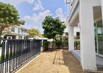 Spacious garden area with greenery near the house