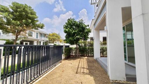 Spacious garden area with greenery near the house