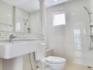 Modern bathroom with fixtures including toilet, sink, and shower