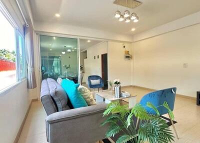 Modern living room with large window and contemporary furnishings