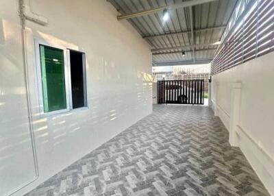 Covered outdoor area with tiled flooring