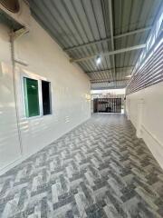 Covered outdoor area with tiled flooring