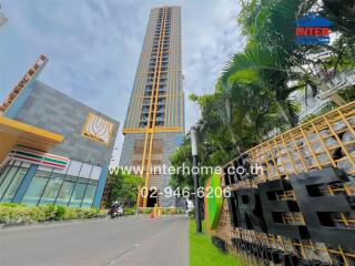 Outside view of a tall building with surrounding greenery