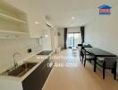 Modern open-plan kitchen and dining area with natural light