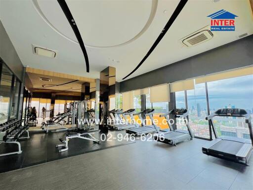 Gym with city view in modern building