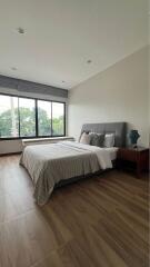 Spacious bedroom with large windows