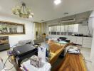 Living room with wooden dining table, office equipment, and seating area