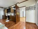 Spacious living room with wooden flooring and built-in desk area