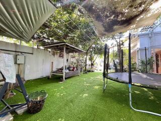 Spacious backyard with exercise area and green space