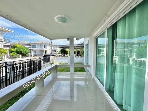 Spacious balcony with a view of a residential neighborhood