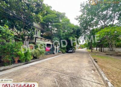 Outdoor view of a residential area with trees and houses