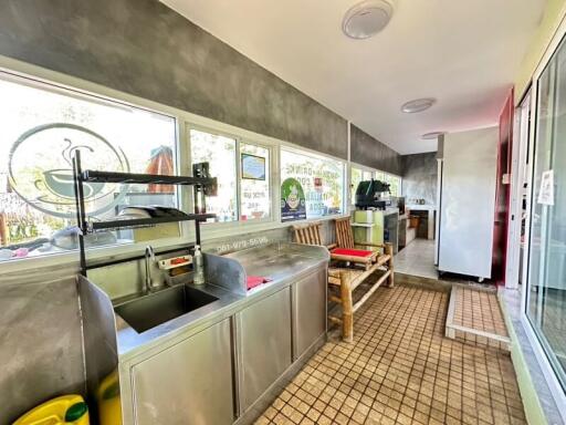 Modern kitchen with stainless steel sink and ample natural light