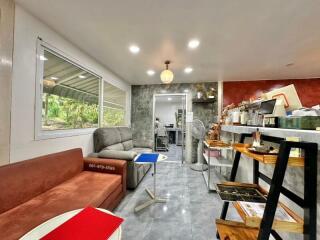 Modern living room with stylish furnishings and open kitchen