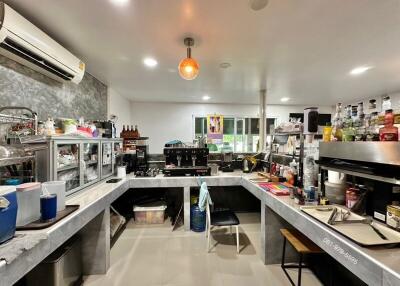 Well-equipped and cluttered kitchen with appliances and ingredients