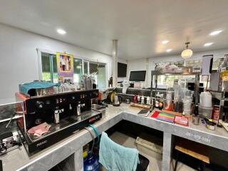 Modern kitchen with coffee maker and various appliances