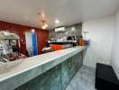 Modern kitchen with marble countertop and bar seating