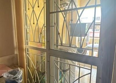 View of a balcony through glass and metal doors
