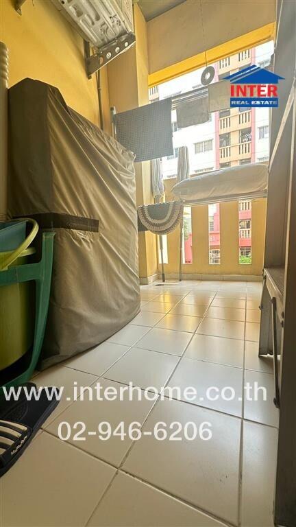 Outdoor balcony area with laundry facilities