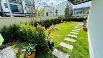 Beautiful garden with a well-maintained lawn and stepping stones