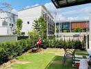 backyard garden with chairs and plants