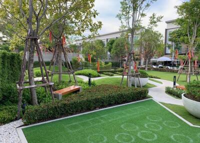 Beautifully landscaped garden with walking paths and seating areas