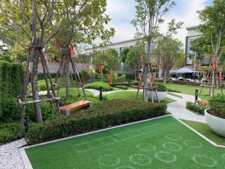 Beautifully landscaped garden with walking paths and seating areas