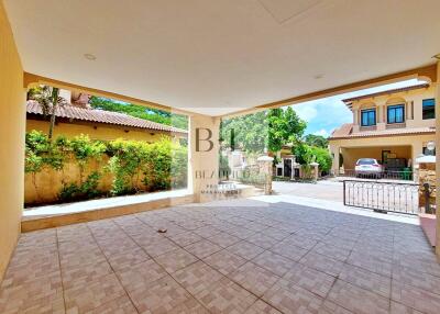 Covered outdoor patio with tiled flooring