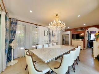 Elegant dining room with chandelier and large dining table