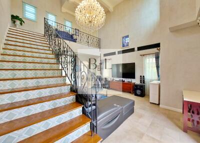 Spacious living room with modern decor and chandelier